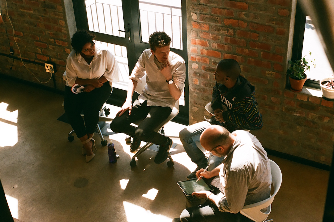 CodeConvo panelists prepare to speak about the intersection of coding and creativity.